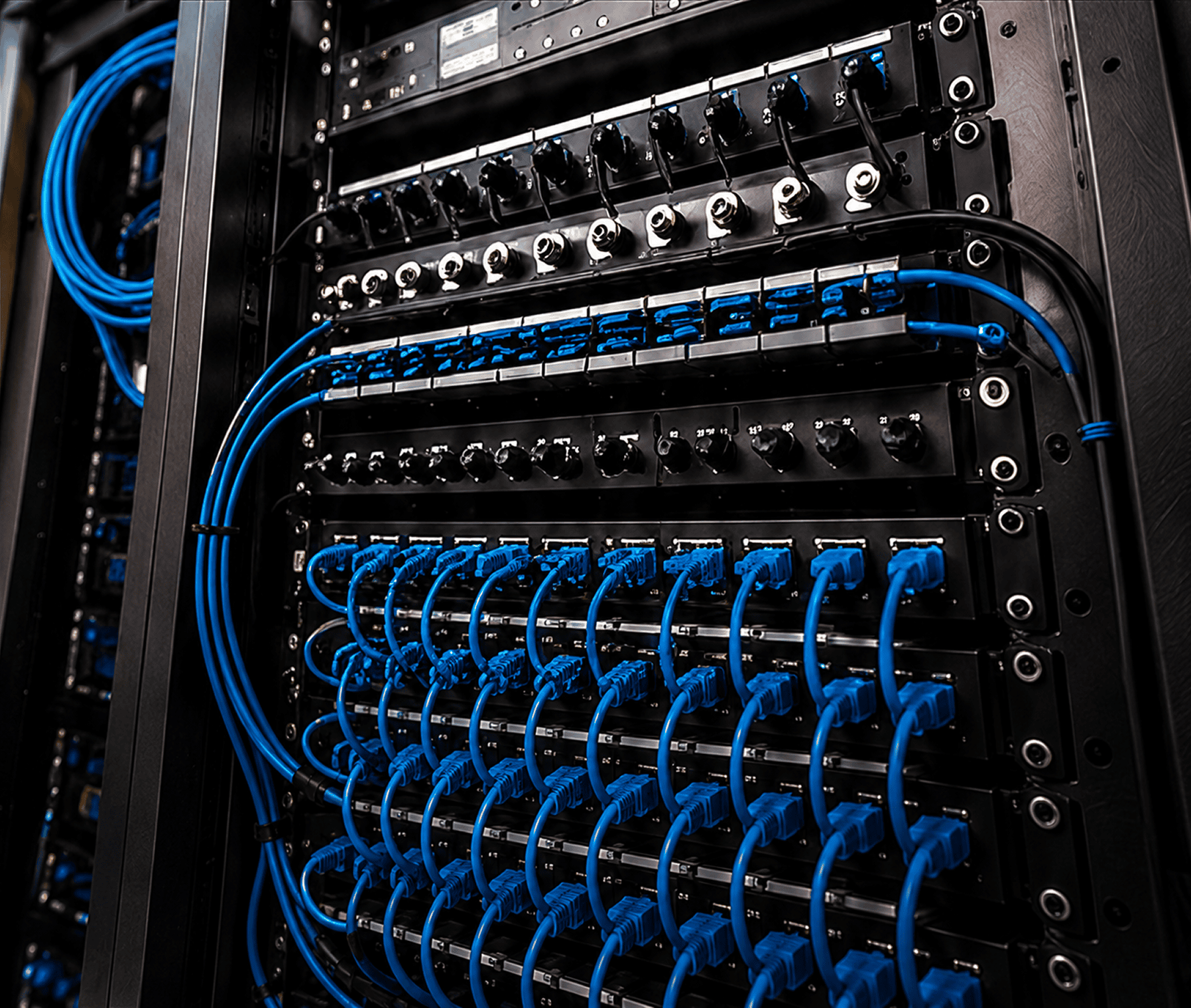 Server rack patch panel with blue Ethernet cables