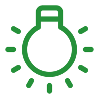 Green light bulb icon with glowing rays