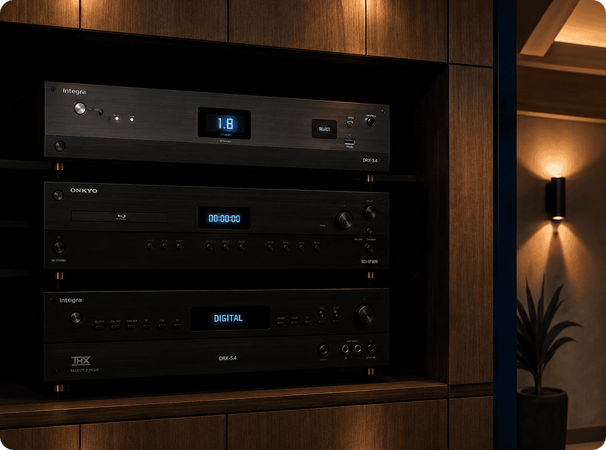 Three black AV components in wooden cabinet